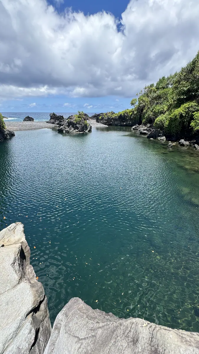 Still water inside a lava rock cove
