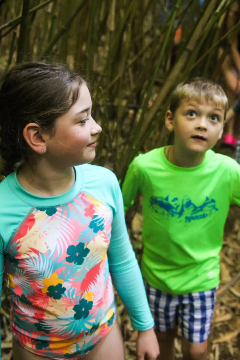 Two kids in rash guards on the trail